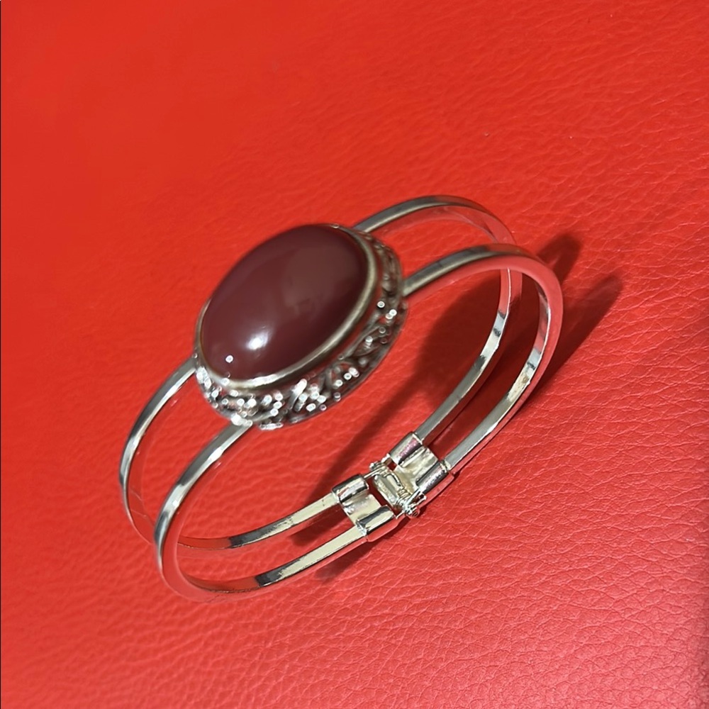 Bracelet Silver and Red Open-Ended with Ornate Stone Setting.